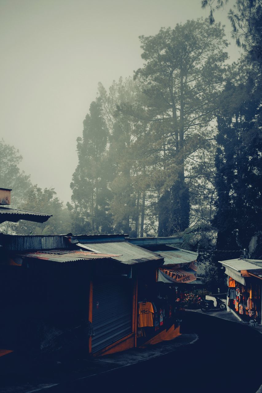 HOUSES AND TREES AGAINST SKY