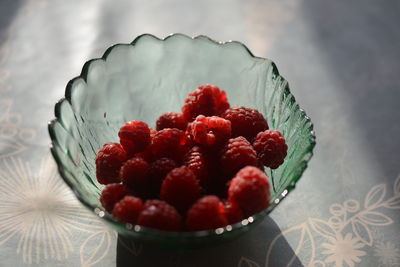 High angle view of strawberries in bowl on table