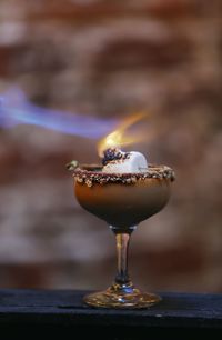 Close-up of fire on dessert served on table 