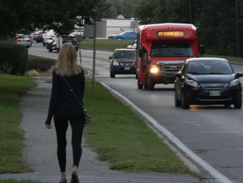 Rear view of man walking on street