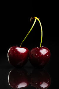 Close-up of strawberry over black background