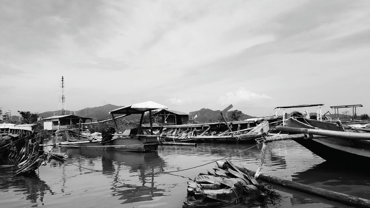 VIEW OF RIVER WITH BUILDINGS IN BACKGROUND