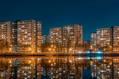 Night view on tysiaclecie estate in katowice, silesia, poland. lightened residential buildings 