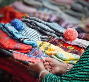 Close-up of woman hands knitting woolen socks