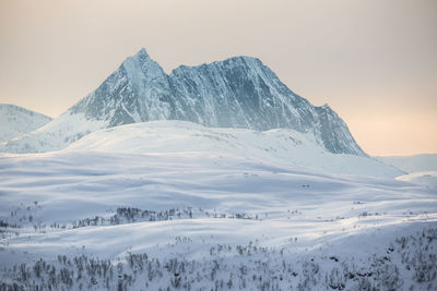 Scenic view of snow covered mountains