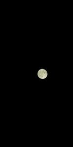 Low angle view of moon against sky at night