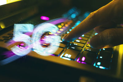 Close-up of hand holding illuminated lights