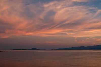 Scenic view of sea against orange sky