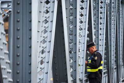 Security guard standing over a steel bridge in shanghai china