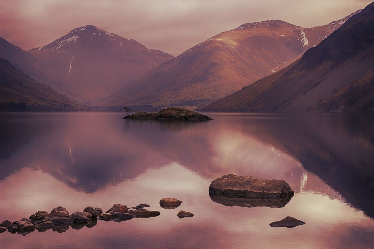 mountain, water, reflection, tranquil scene, tranquility, lake, scenics, mountain range, beauty in nature, nature, waterfront, sky, standing water, idyllic, non-urban scene, physical geography, river, majestic, calm, rock - object