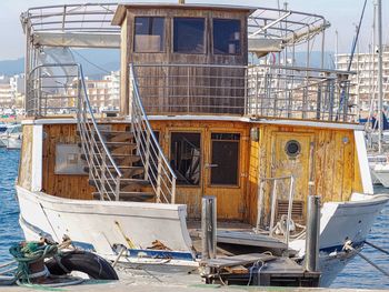 Boats moored at harbor