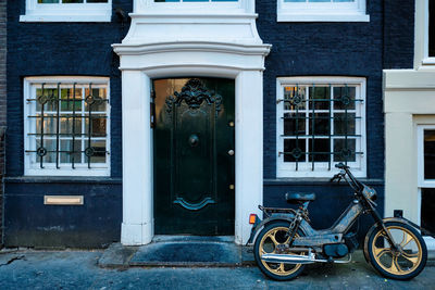 Bicycles on street by building