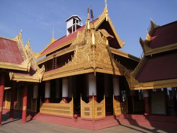 Low angle view of temple against sky in city