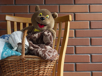 Close-up of stuffed toy against wall