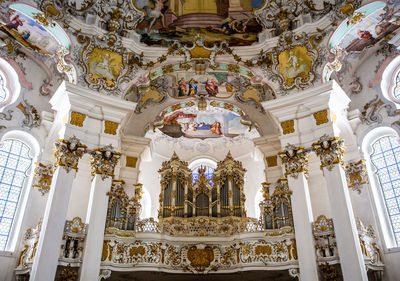 Low angle view of chandelier in building