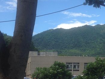 House with mountain range in background