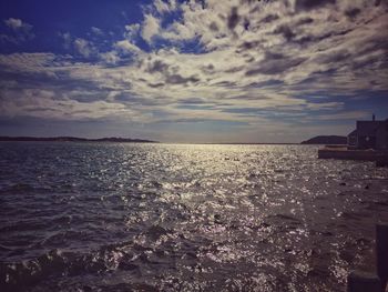 Scenic view of sea against cloudy sky