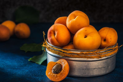 Close-up of fruits in basket on table