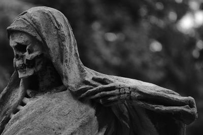 Close-up of angel statue in cemetery