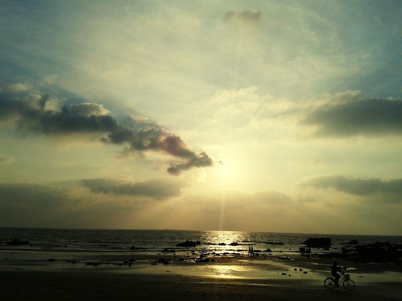 sea, horizon over water, beach, water, sunset, sky, sun, scenics, shore, beauty in nature, tranquil scene, tranquility, cloud - sky, nature, idyllic, sand, sunlight, nautical vessel, incidental people, cloud