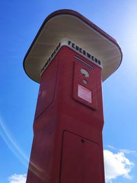Low angle view of tower against blue sky