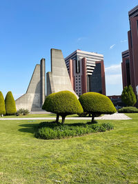 Low angle view of building against clear blue sky