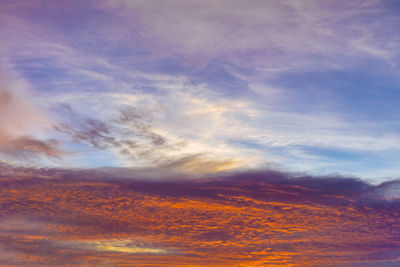 Low angle view of dramatic sky during sunset