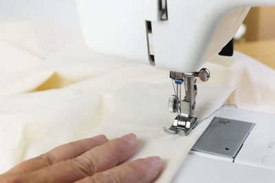 Cropped hand stitching textile using sewing machine