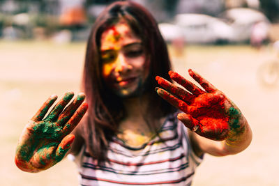 Close-up of woman covered with powder paint