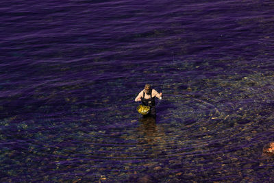 Man fishing in sea