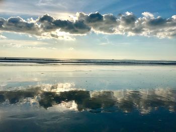 Scenic view of sea against sky at sunset