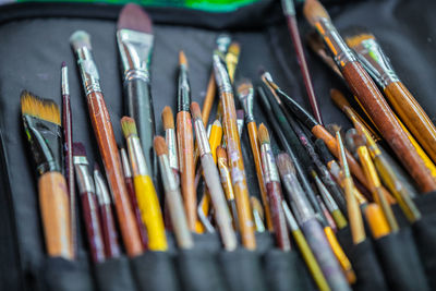 Close-up of paintbrushes on table