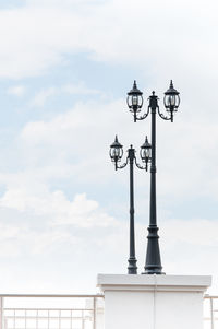 Low angle view of street light against sky