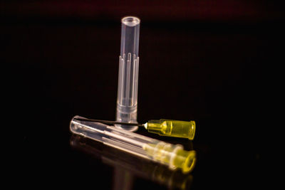 High angle view of glasses on table against black background