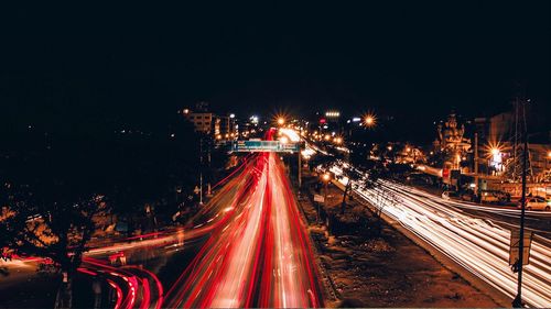 High angle view of light trails on road at night