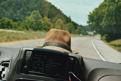 Hat by car windshield