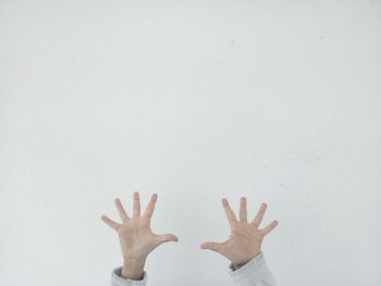 Cropped image of person hands against white background