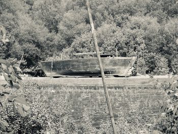 Abandoned boat on field