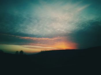 Scenic view of silhouette landscape against sky during sunset