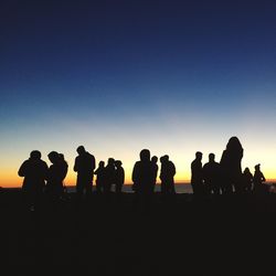 Silhouette people at sunset