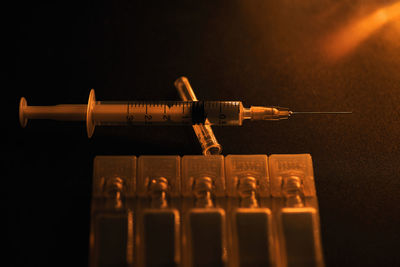 Close-up of typewriter in row against black background