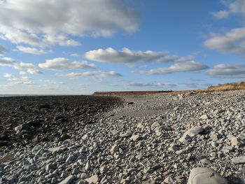 Scenic view of beach against sky