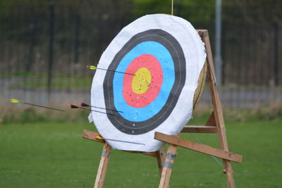 Close-up of umbrella on field