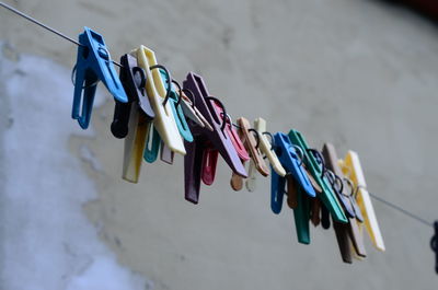 Close-up of clothes hanging on wall