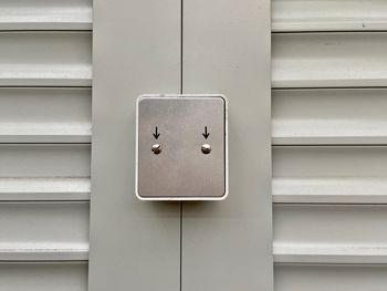 Close-up of telephone booth on wall