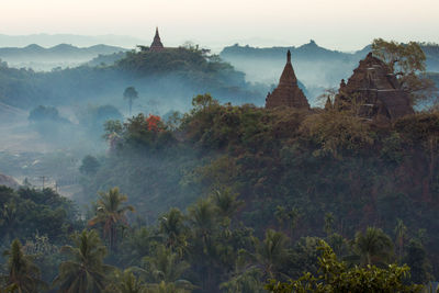 Panoramic view of temple and building against sky