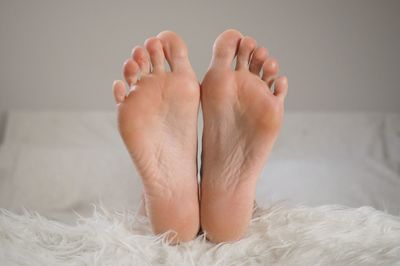 Low section of person at home