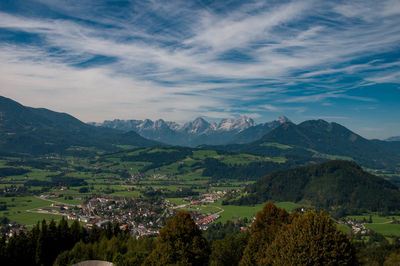 Scenic view of landscape and mountains against sky