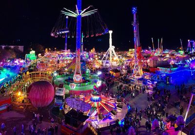 High angle view of amusement park ride at night