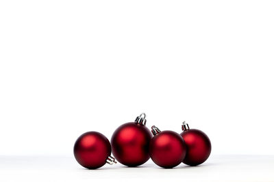 Close-up of tomatoes against white background